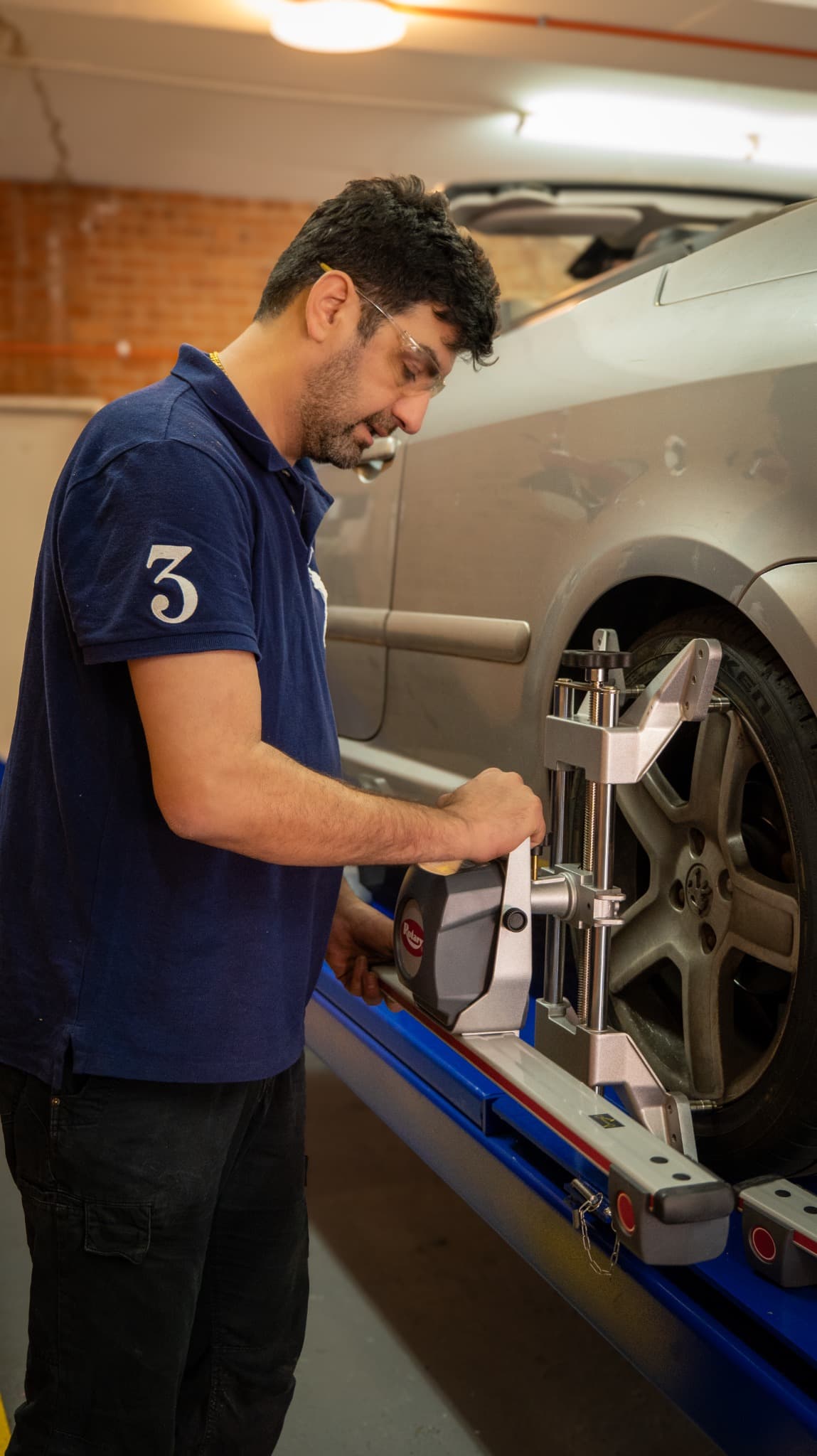 Hornsby Car Care mechanic working on wheel alignment